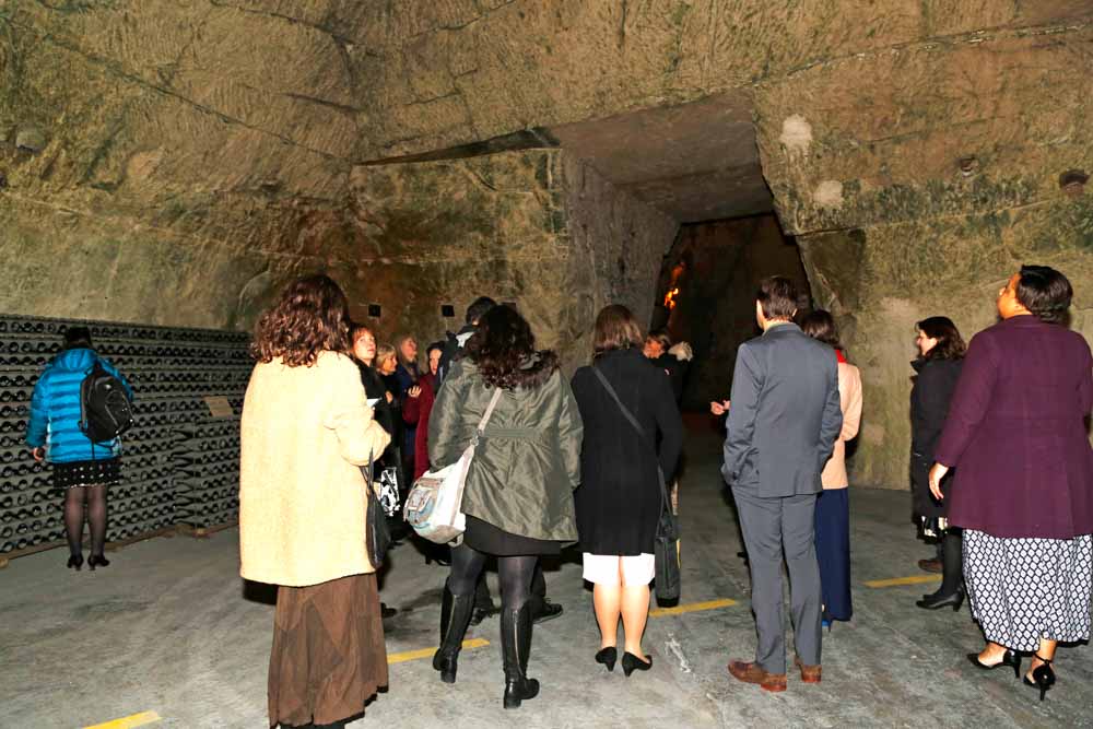 Guild members learning about the cultural heritage of the Champagne region during a visit to the cellars where Veuve Clicquot Champagne is produced